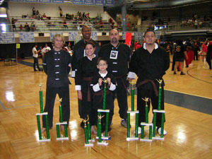 Wang's Martial Arts student with trophy picture